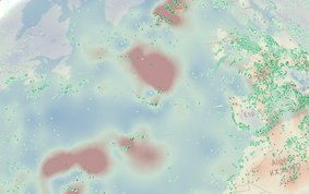 A circular section of the world map with bright red, green and blue areas. On the left is America with lots of small green dots; in the centre is the Atlantic Ocean with scattered small green dots; on the right are Europe, Africa and Asia with a high density of small green dots.
