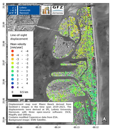 Ein Satellitenbild von Miami Beach mit den Barriereinseln und Gebäuden mit grünen, gelben und roten Punkten, die Verschiebungsmessungen anzeigen. Im Bild: Informationen zum Farb-Code.