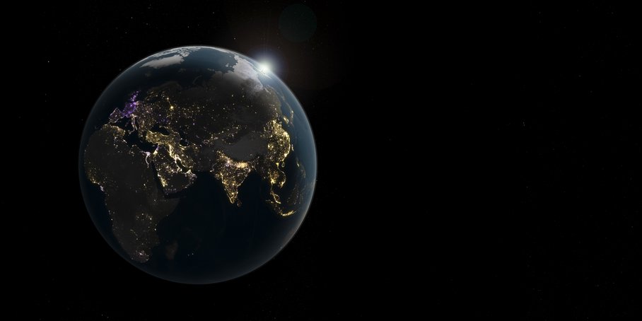 A view of the entire Earth at night. Bright spots indicate where light is being emitted into space from the Earth’s surface. It is particularly bright along many of the Earth’s coastlines and in areas where large cities and metropolitan regions are located. Golden areas indicate an increase in brightness, purple areas a decrease, and white areas both.