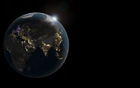 A view of the entire Earth at night. Bright spots indicate where light is being emitted into space from the Earth’s surface. It is particularly bright along many of the Earth’s coastlines and in areas where large cities and metropolitan regions are located. Golden areas indicate an increase in brightness, purple areas a decrease, and white areas both.