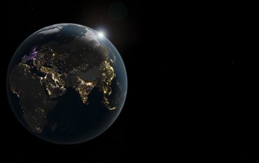 A view of the entire Earth at night. Bright spots indicate where light is being emitted into space from the Earth’s surface. It is particularly bright along many of the Earth’s coastlines and in areas where large cities and metropolitan regions are located. Golden areas indicate an increase in brightness, purple areas a decrease, and white areas both.