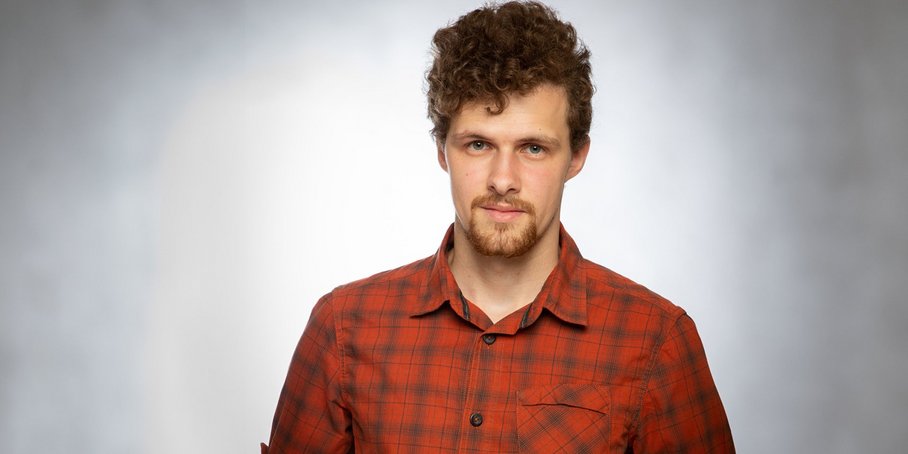 Ilya Bobrovskiy wearing a red shirt.