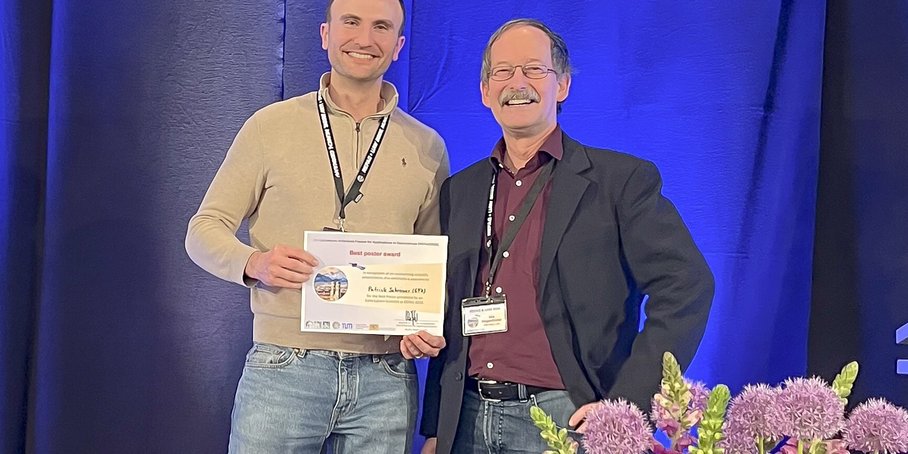 Two people on stage.