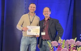 Two people on stage.