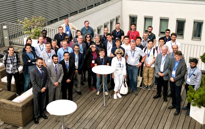 Group photo: people on the roof terrace of a house