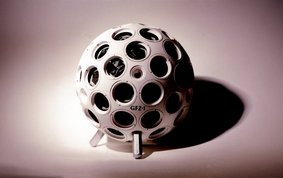 Football-sized round white satellite with 60 reflectors on its surface.