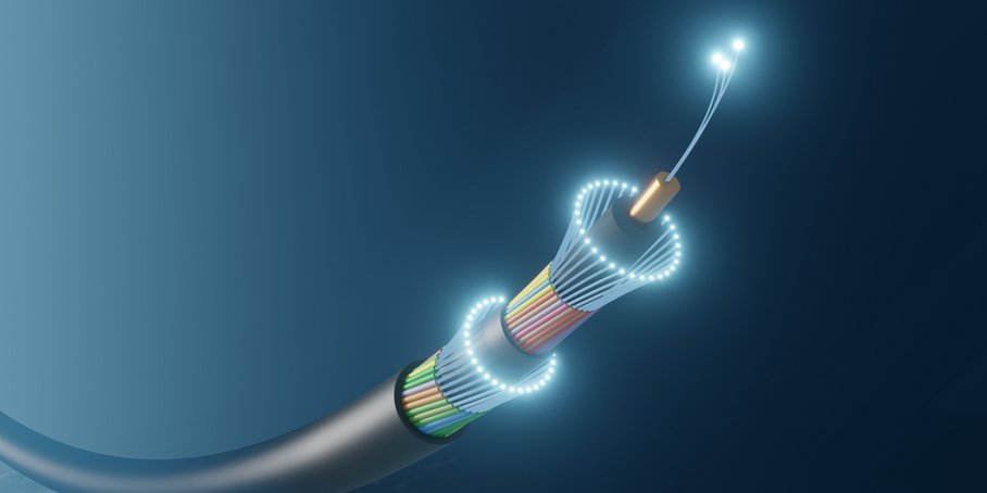 A fibre optic cable with a luminous tip surrounded by the blue ocean