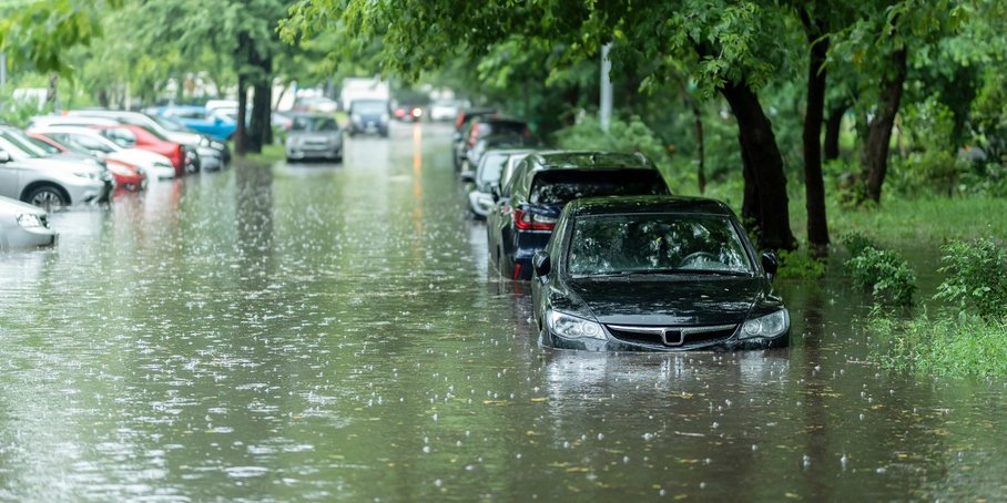 Parked cars in meters of high water.