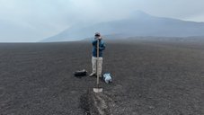 Sergio is collected samples at Etna volcano (summit crater in the background) from the scoria layer where the fibre optic cable has been deployed in 2019 (“Fame” project).